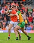 12 June 2022; Greg McCabe of Armagh in action against Michael Murphy of Donegal during the GAA Football All-Ireland Senior Championship Round 2 match between between Donegal and Armagh at St Tiernach's Park in Clones, Monaghan. Photo by Seb Daly/Sportsfile