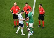 11 June 2022; Team captains Andy Robertson of Scotland, left, and John Egan of Republic of Ireland exchange pennants before the UEFA Nations League B group 1 match between Republic of Ireland and Scotland at the Aviva Stadium in Dublin. Photo by Ben McShane/Sportsfile