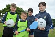 14 June 2022; St Oliver’s National School in Killarney, Kerry, was among twenty-six schools across the country that have joined an initiative organised between Allianz and Cumann na mBunscol, that will support Ukrainian schoolchildren participate in local Gaelic game activities through their schools. The initiative sees Allianz provide these schools with 500 footballs, 200 hurleys and 200 sliothars to help Ukrainian refugee schoolchildren fall in love with our national games and integrate into their local communities. Pictured are students from St Oliver’s National School, from left, Cian Hegarty, Eryk McGrath, Mary Pierce and Viktoria Kurlaeva. Photo by Brendan Moran/Sportsfile