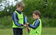 14 June 2022; St Oliver’s National School in Killarney, Kerry, was among twenty-six schools across the country that have joined an initiative organised between Allianz and Cumann na mBunscol, that will support Ukrainian schoolchildren participate in local Gaelic game activities through their schools. The initiative sees Allianz provide these schools with 500 footballs, 200 hurleys and 200 sliothars to help Ukrainian refugee schoolchildren fall in love with our national games and integrate into their local communities. Pictured are students from St Oliver’s National School Cian Hegarty, left, and Eryk McGrath. Photo by Brendan Moran/Sportsfile