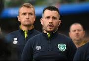 11 June 2022; Republic of Ireland chartered physiotherapist's Kevin Mulholland and Danny Miller, left, stand for the playing of the National Anthem before the UEFA Nations League B group 1 match between Republic of Ireland and Scotland at the Aviva Stadium in Dublin. Photo by Stephen McCarthy/Sportsfile