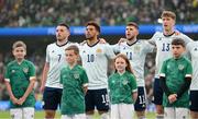 11 June 2022; Mascots and Scotland players stand for the playing of the National Anthem before the UEFA Nations League B group 1 match between Republic of Ireland and Scotland at the Aviva Stadium in Dublin. Photo by Stephen McCarthy/Sportsfile