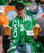 14 June 2022; A Republic of Ireland supporter brings refreshments to his seat before the UEFA Nations League B group 1 match between Ukraine and Republic of Ireland at LKS Stadium in Lodz, Poland. Photo by Stephen McCarthy/Sportsfile