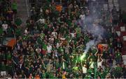 14 June 2022; Republic of Ireland supporters celebrate their side's first goal, scored by Nathan Collins, during the UEFA Nations League B group 1 match between Ukraine and Republic of Ireland at LKS Stadium in Lodz, Poland. Photo by Stephen McCarthy/Sportsfile