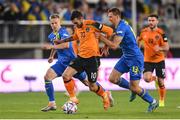 14 June 2022; Troy Parrott of Republic of Ireland in action against Oleksandr Zinchenko, left, and Illia Zabarnyi of Ukraine during the UEFA Nations League B group 1 match between Ukraine and Republic of Ireland at LKS Stadium in Lodz, Poland. Photo by Stephen McCarthy/Sportsfile