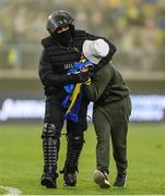 14 June 2022; A pitch invader is restrained by a Riot Police officer after the UEFA Nations League B group 1 match between Ukraine and Republic of Ireland at LKS Stadium in Lodz, Poland. Photo by Stephen McCarthy/Sportsfile