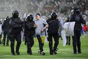 14 June 2022; A pitch invader is escorted from the pitch by Riot Police after the UEFA Nations League B group 1 match between Ukraine and Republic of Ireland at LKS Stadium in Lodz, Poland. Photo by Stephen McCarthy/Sportsfile
