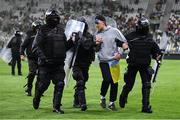 14 June 2022; A pitch invader is escorted from the pitch by Riot Police after the UEFA Nations League B group 1 match between Ukraine and Republic of Ireland at LKS Stadium in Lodz, Poland. Photo by Stephen McCarthy/Sportsfile