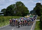 15 June 2022; The peloton makes it way along the Dublin Road to Athy during Stage 1 of the Rás Tailteann 2022 at Horse and Jockey in Parkstown, Tipperary. Photo by David Fitzgerald/Sportsfile