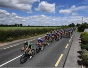 15 June 2022; The peloton led by Adam Ward of Team Ireland makes it way along the Dublin Road to Athy during Stage 1 of the Rás Tailteann 2022 at Horse and Jockey in Parkstown, Tipperary. Photo by David Fitzgerald/Sportsfile