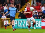 17 June 2022; Mark Doyle of St Patrick's Athletic in action against Michael Gallagher of UCD during the SSE Airtricity League Premier Division match between St Patrick's Athletic and UCD at Richmond Park in Dublin. Photo by Michael P Ryan/Sportsfile