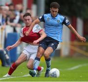 17 June 2022; Darragh Burns of St Patrick's Athletic in action against Evan Osam of UCD during the SSE Airtricity League Premier Division match between St Patrick's Athletic and UCD at Richmond Park in Dublin. Photo by Michael P Ryan/Sportsfile