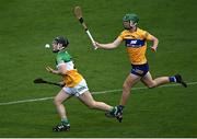 17 June 2022; James Mahon of Offaly in action against Oisín Whelan of Clare during the Electric Ireland GAA Hurling All-Ireland Minor Championship Semi-Final match between Offaly and Clare at FBD Semple Stadium in Thurles, Tipperary. Photo by Piaras Ó Mídheach/Sportsfile