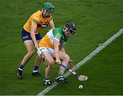 17 June 2022; James Mahon of Offaly in action against Oisín Whelan of Clare during the Electric Ireland GAA Hurling All-Ireland Minor Championship Semi-Final match between Offaly and Clare at FBD Semple Stadium in Thurles, Tipperary. Photo by Piaras Ó Mídheach/Sportsfile