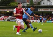 17 June 2022; Evan Osam of UCD in action against Darragh Burns of St Patrick's Athletic during the SSE Airtricity League Premier Division match between St Patrick's Athletic and UCD at Richmond Park in Dublin. Photo by Michael P Ryan/Sportsfile