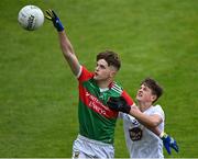 12 June 2022; Ronan Clarke of Mayo in action against Evan O'Briain of Kildare during the Electric Ireland GAA Football All-Ireland Minor Championship Quarter-Final match between Mayo and Kildare at O'Connor Park in Tullamore, Offaly. Photo by Piaras Ó Mídheach/Sportsfile