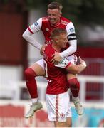 17 June 2022; Eoin Doyle of St Patrick's Athletic, bottom, celebrates after scoring his side's first goal with team-mate Chris Forrester during the SSE Airtricity League Premier Division match between St Patrick's Athletic and UCD at Richmond Park in Dublin. Photo by Michael P Ryan/Sportsfile