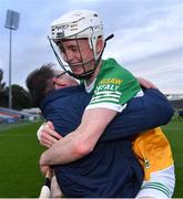 17 June 2022; Brecon Kavanagh of Offaly celebrates with Offaly selector Johnny Pinkington after their side's victory in the Electric Ireland GAA Hurling All-Ireland Minor Championship Semi-Final match between Offaly and Clare at FBD Semple Stadium in Thurles, Tipperary. Photo by Piaras Ó Mídheach/Sportsfile