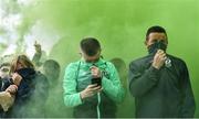 17 June 2022; Shamrock Rovers supporters shield their faces from a smoke bomb before the SSE Airtricity League Premier Division match between Dundalk and Shamrock Rovers at Oriel Park in Dundalk, Louth. Photo by Ben McShane/Sportsfile