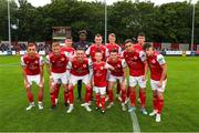 17 June 2022; St Patrick's Athletic team pose for a picture with match day mascot Mason Cox during the SSE Airtricity League Premier Division match between St Patrick's Athletic and UCD at Richmond Park in Dublin. Photo by Michael P Ryan/Sportsfile