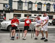 18 June 2022; Cork supporters, from left, Fin O'Donovan, Darren Daly, Michael Veal and Alan Davis, all from Skibereen, enjoy a snack outside Hayes Hotel in Liberty Square ahead of the GAA Hurling All-Ireland Senior Championship Quarter-Final match between Galway and Cork at the FBD Semple Stadium in Thurles, Tipperary. Photo by Ray McManus/Sportsfile