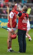 18 June 2022; Cork physio Declan O'Sullivan applies vaseline to the eyebrows of Christopher Joyce ahead of the GAA Hurling All-Ireland Senior Championship Quarter-Final match between Galway and Cork at the FBD Semple Stadium in Thurles, Tipperary. Photo by Daire Brennan/Sportsfile