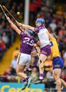 18 June 2022; Wexford players Shane Reck and Mark Fanning and Tony Kelly of Clare contest a dropping sliotar during the GAA Hurling All-Ireland Senior Championship Quarter-Final match between Clare and Wexford at the FBD Semple Stadium in Thurles, Tipperary. Photo by Ray McManus/Sportsfile