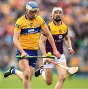 18 June 2022; Diarmuid Ryan of Clare is tackled by Oisín Foley of Wexford during the GAA Hurling All-Ireland Senior Championship Quarter-Final match between Clare and Wexford at the FBD Semple Stadium in Thurles, Tipperary. Photo by Ray McManus/Sportsfile