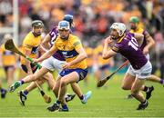 18 June 2022; Diarmuid Ryan of Clare is tackled by Oisín Foley of Wexford during the GAA Hurling All-Ireland Senior Championship Quarter-Final match between Clare and Wexford at the FBD Semple Stadium in Thurles, Tipperary. Photo by Ray McManus/Sportsfile