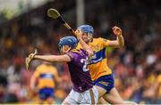 18 June 2022; Shane Reck of Wexford is tackled by Shane O'Donnell of Clare during the GAA Hurling All-Ireland Senior Championship Quarter-Final match between Clare and Wexford at the FBD Semple Stadium in Thurles, Tipperary. Photo by Ray McManus/Sportsfile