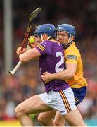 18 June 2022; Shane Reck of Wexford is tackled by Shane O'Donnell of Clare during the GAA Hurling All-Ireland Senior Championship Quarter-Final match between Clare and Wexford at the FBD Semple Stadium in Thurles, Tipperary. Photo by Ray McManus/Sportsfile