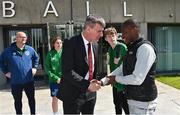 25 June 2022; Republic of Ireland manager Stephen Kenny, left, shakes hands with Inza Bamba during a Republic of Ireland Refugee Team meet and greet at FAI Headquarters in Abbotstown, Dublin. Photo by Sam Barnes/Sportsfile
