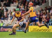 18 June 2022; Matthew O'Hanlon of Wexford is tackled by Peter Duggan of Clare during the GAA Hurling All-Ireland Senior Championship Quarter-Final match between Clare and Wexford at the FBD Semple Stadium in Thurles, Tipperary. Photo by Ray McManus/Sportsfile