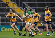 17 June 2022; Niall Furlong of Offaly in action against Michael Collins of Clare during the Electric Ireland GAA Hurling All-Ireland Minor Championship Semi-Final match between Offaly and Clare at FBD Semple Stadium in Thurles, Tipperary. Photo by Piaras Ó Mídheach/Sportsfile