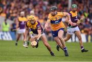 18 June 2022; Damien Reck of Wexford in action against Tony Kelly of Clare during the GAA Hurling All-Ireland Senior Championship Quarter-Final match between Clare and Wexford at the FBD Semple Stadium in Thurles, Tipperary. Photo by Daire Brennan/Sportsfile