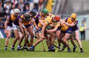 18 June 2022; Players from both sides contest for the ball during the GAA Hurling All-Ireland Senior Championship Quarter-Final match between Clare and Wexford at the FBD Semple Stadium in Thurles, Tipperary. Photo by Daire Brennan/Sportsfile