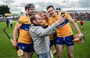 18 June 2022; A Clare supporter and his child pose for a 'selfie' with Clare players Tony Kelly, Jack Browne and David Fitzgerald after the GAA Hurling All-Ireland Senior Championship Quarter-Final match between Clare and Wexford at the FBD Semple Stadium in Thurles, Tipperary. Photo by Ray McManus/Sportsfile