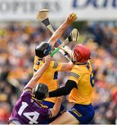 18 June 2022; David McInerney of Clare wins possession ahead of team mate John Conlon and Conor McDonald of Wexford during the GAA Hurling All-Ireland Senior Championship Quarter-Final match between Clare and Wexford at the FBD Semple Stadium in Thurles, Tipperary. Photo by Ray McManus/Sportsfile