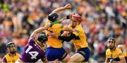 18 June 2022; David McInerney of Clare wins possession ahead of team mate John Conlon and Conor McDonald of Wexford during the GAA Hurling All-Ireland Senior Championship Quarter-Final match between Clare and Wexford at the FBD Semple Stadium in Thurles, Tipperary. Photo by Ray McManus/Sportsfile