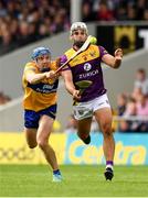 18 June 2022; Conor Devitt of Wexford is tackled by Shane O'Donnell of Clare during the GAA Hurling All-Ireland Senior Championship Quarter-Final match between Clare and Wexford at the FBD Semple Stadium in Thurles, Tipperary. Photo by Ray McManus/Sportsfile