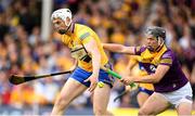 18 June 2022; Conor Cleary of Clare is tackled by Conor McDonald of Wexford during the GAA Hurling All-Ireland Senior Championship Quarter-Final match between Clare and Wexford at the FBD Semple Stadium in Thurles, Tipperary. Photo by Ray McManus/Sportsfile