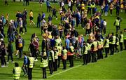 18 June 2022; Security personnel move along the pitch as supporters prepare to leave after the GAA Hurling All-Ireland Senior Championship Quarter-Final match between Clare and Wexford at the FBD Semple Stadium in Thurles, Tipperary. Photo by Ray McManus/Sportsfile