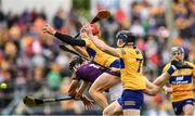 18 June 2022; John Conlon of Clare, supported by team mate David McInerney, 7, like Jack O'Connor of Wexford fails to catch the sliotar during the GAA Hurling All-Ireland Senior Championship Quarter-Final match between Clare and Wexford at the FBD Semple Stadium in Thurles, Tipperary. Photo by Ray McManus/Sportsfile