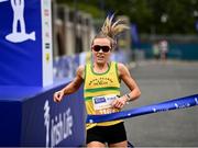 19 June 2022; Ciara Hickey of Brothers Pearse AC crosses the line to finish as the first place woman during the Irish Life Dublin Race Series – Tallaght 5 Mile at Tallaght in Dublin. Photo by David Fitzgerald/Sportsfile
