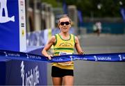 19 June 2022; Ciara Hickey of Brothers Pearse AC crosses the line to finish as the first place woman during the Irish Life Dublin Race Series – Tallaght 5 Mile at Tallaght in Dublin. Photo by David Fitzgerald/Sportsfile