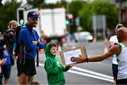 19 June 2022; Liam Judge, age 8, from Dublin offers encouragement to the runners during the Irish Life Dublin Race Series – Tallaght 5 Mile at Tallaght in Dublin. Photo by David Fitzgerald/Sportsfile