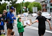 19 June 2022; Luke Judge, age 8, from Dublin offers encouragement to the runners during the Irish Life Dublin Race Series – Tallaght 5 Mile at Tallaght in Dublin. Photo by David Fitzgerald/Sportsfile