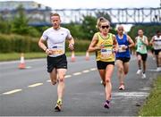 19 June 2022; Anthony Brady, left, and Ciara Hickey of Pearse Brothers AC during the Irish Life Dublin Race Series – Tallaght 5 Mile at Tallaght in Dublin. Photo by David Fitzgerald/Sportsfile