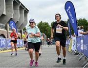 19 June 2022; Cora Killeen, left, and Jamie Kinsella during the Irish Life Dublin Race Series – Tallaght 5 Mile at Tallaght in Dublin. Photo by David Fitzgerald/Sportsfile