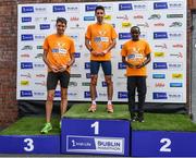 19 June 2022; The mens podium, first place, Hugh Armstrong of Ballina AC, centre, second place, Peter Somba of Dunboyne AC, right, and third place, Tomas Fitzpatrick of Tallaght AC, left, after the Irish Life Dublin Race Series – Tallaght 5 Mile at Tallaght in Dublin. Photo by David Fitzgerald/Sportsfile